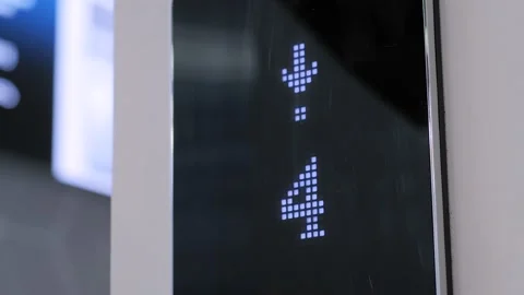 Digital elevator display showing floor number - lift going down and up: close up Stock Footage 152342637