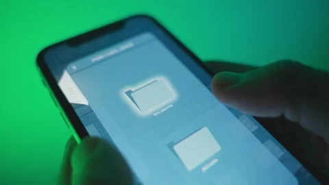 Digital files and documents are sent or transferred from mobile device in dark Видео 323842680
