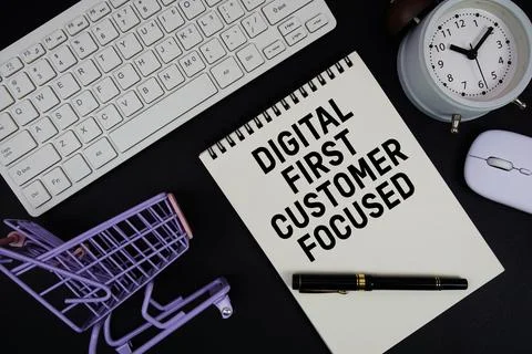 Digital First. Customer Focused text written on notepad with keyboard and t.. Stock Photos