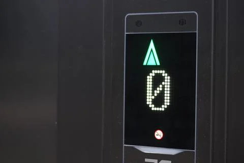 Digital floor indicator shows number zero and up arrow Stock Photos