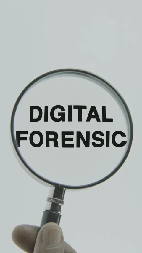 Digital Forensic text or word highlighted by a magnifying glass in a hand Stock Footage 303433231