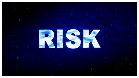 Digital glitch text display showing risk concept with flickering blue Stock Footage 344715240