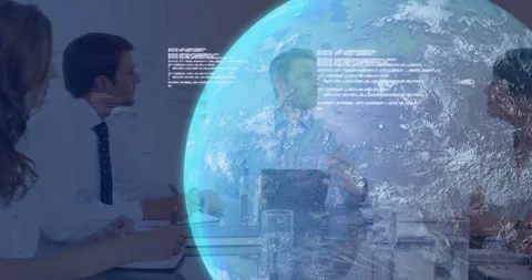 Digital globe appearing above table streaming code and team noting swiping Stock Footage 313149555