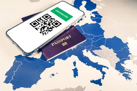 Digital green passport with QR code on a smartphone over an EU map 스톡 사진