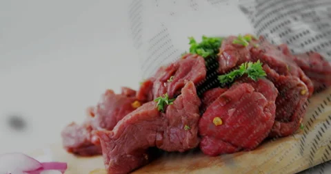 Digital grid appearing then sweeping across raw beef while camera zooming closer Stock Footage 312408322