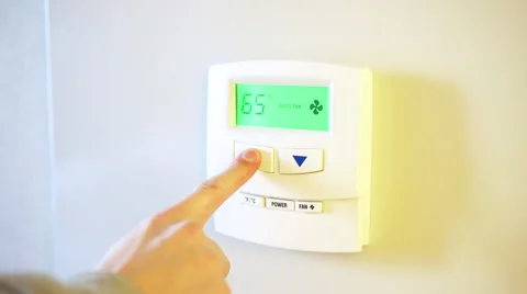 Digital home thermostat turned up to increase temperature 4k Stock Footage