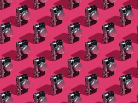 Digital illustration of a 3D camera pattern pink background for wallpapers Illustrazione stock