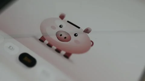 Digital illustration of coins falling into a smiling piggy bank for finance Stock Footage 335493947