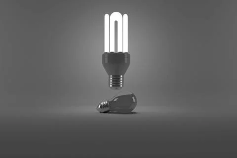 Digital image of illuminated energy efficient lightbulb over bulb Illustrazione stock