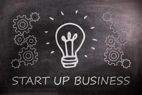 Digital image of light bulb amidst gears over start up business text against  Selección de ilustraciones gratis