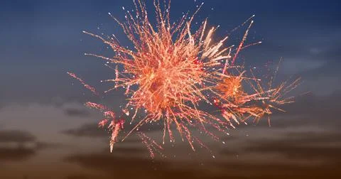 Digital image of red fireworks exploding in the sky with clouds during sunset Stock Photos