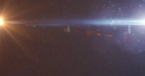 Digital image of spot of light and white particles against copy space on black Stock Photos