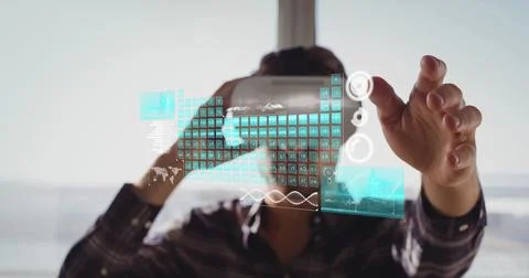 Digital interface with data processing against person man wearing vr headset at Stock Photos