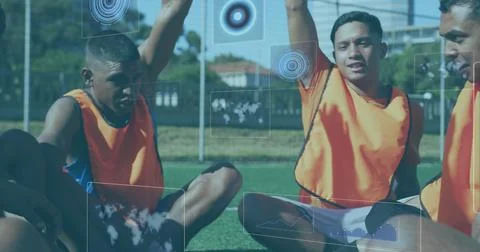 Digital interface with data processing against team of male soccer players Stock Photos