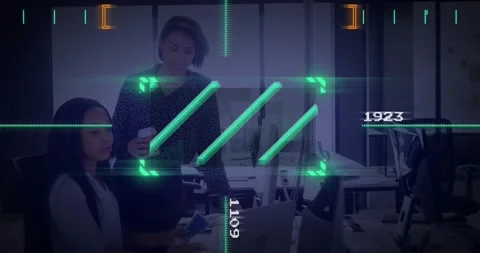 Digital interface elements over businesswomen working in modern office Stock Footage 327714922