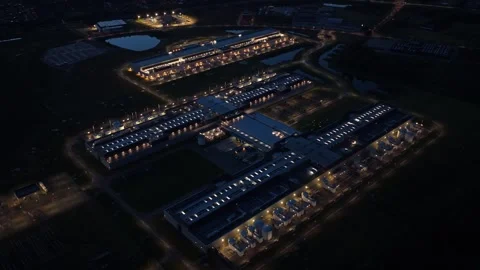 Digital internet backbone and AI server campus lit at night. Stockbeeldmateriaal 318620500