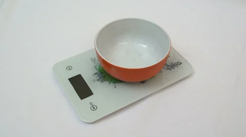 Digital kitchen scale and a bowl with sugar Stock Footage 50035156