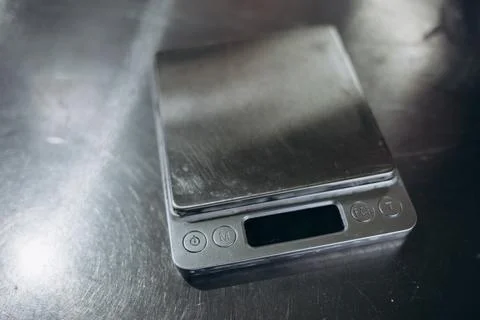 Digital kitchen scales on gray background. Copy space Stock Photos