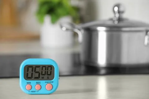 Digital kitchen timer on white table indoors. Space for text Stock Photos