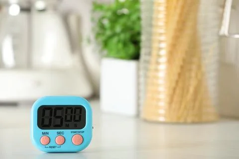 Digital kitchen timer on white table indoors. Space for text Stock Photos