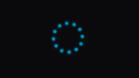 A digital loading animation circle consisting of glowing bright blue dots Video stock 339619260