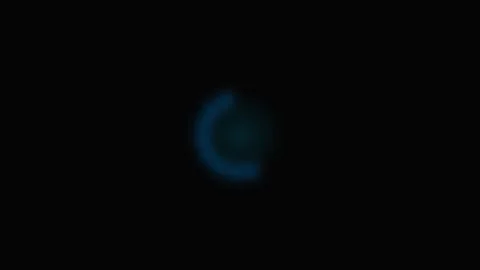 A digital loading spinner with glowing blue dots against a dark background Stock Footage 339614650
