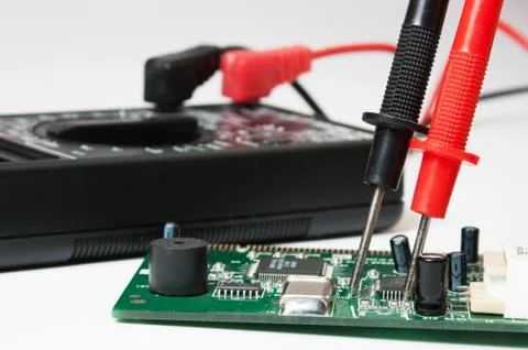 Digital multimeter and electronic boards Stock Photos