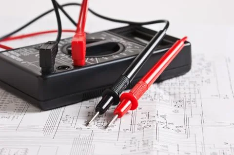 Digital multimeter and an electronic circuit Stock Photos