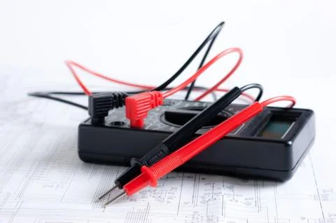 Digital multimeter and an electronic circuit Stock Photos