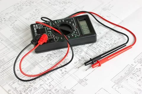 Digital multimeter and an electronic circuit Stock Photos