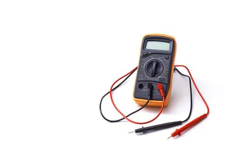 Digital multimeter close-up with test probes isolated on white background. .. Stock Photos