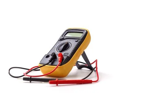 Digital multimeter close-up with test probes isolated on white background. .. Stock Photos