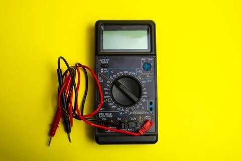 Digital multimeter with red and black probes isolated on white background Stock Photos