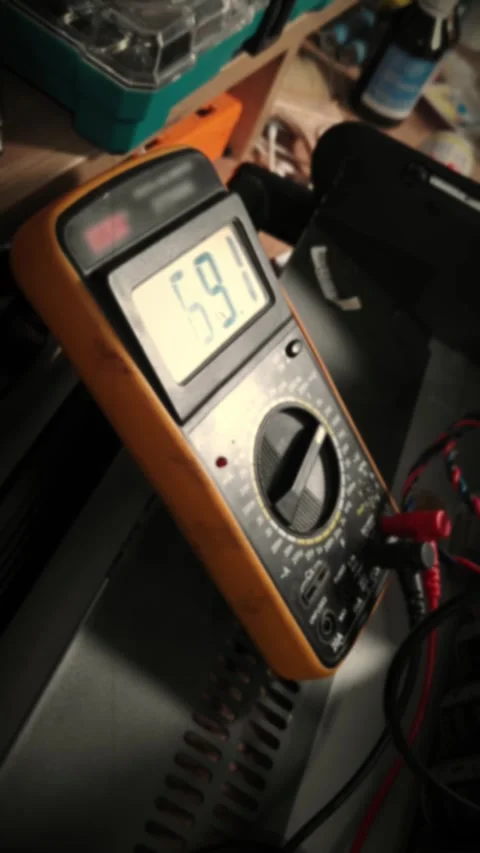 Digital Multimeter Showing Voltage Reading on Workbench in Workshop Stock-Footage 339001803