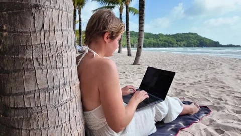Digital Nomad Freelancing on Tropical Beach Stock Footage 263337059
