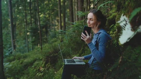 Digital nomad in the sunset forest Stock Footage 273584696