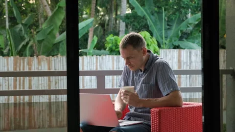 Digital nomad with tropical view and coffee Vídeo Stock 312385351