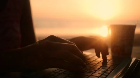 Digital nomad typing at beach in slow motion Stock Footage 60952546
