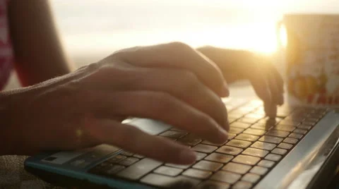 Digital nomad typing on laptop on beach Stock Footage 60931822