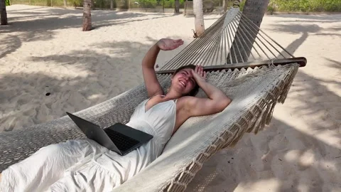 Digital Nomad Working in Beach Hammock Stock Footage 263339068