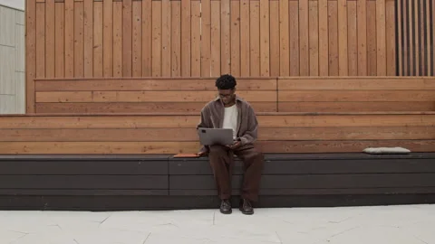 Digital Nomad Working on Bench Stock Footage 320003282