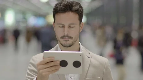 Digital Nomad Working on the go in the City Searching the Web on Computer Device Stock Footage 98553716