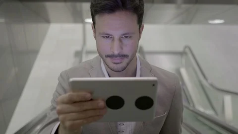 Digital Nomad Working on the go in the City Searching the Web on Computer Device Stock Footage 98553773