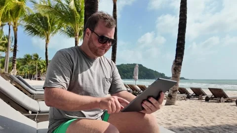 Digital Nomad Working on Tropical Beach 스톡 동영상 263339412