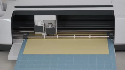 Digital plotter cut out details on yellow cardboard, DIY manual paper craft Stock Footage 277936754
