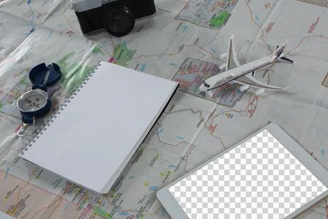 Digital png illustration of map, notes, compass, camera, plane and tablet on Stock Photos