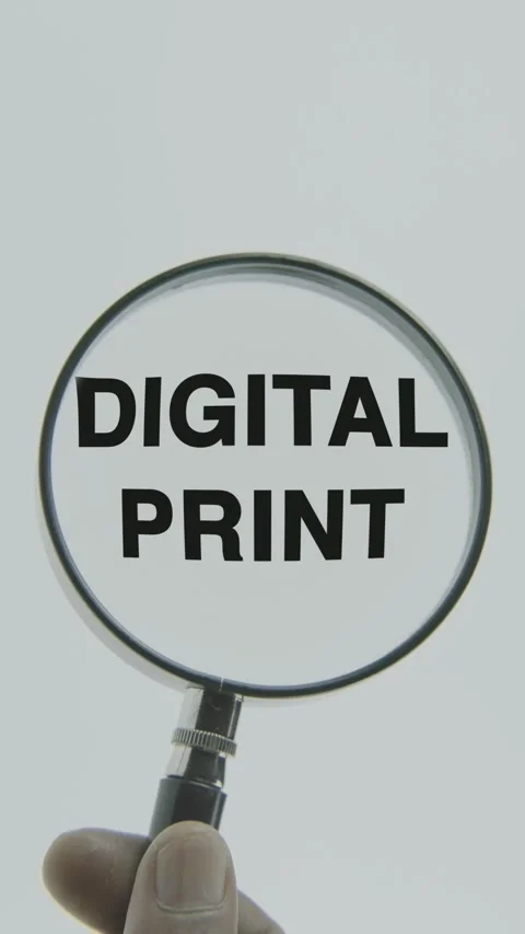 Digital Print text or word highlighted by a magnifying glass in a hand Stock Footage 303433642