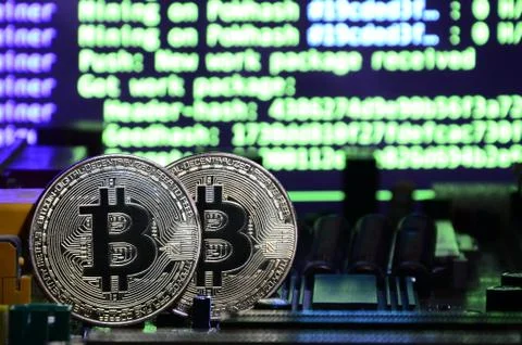 The digital process of cryptocurrency mining by using the GPUs. Bitcoins and  Stock Photos