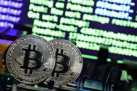 The digital process of cryptocurrency mining by using the GPUs. Bitcoins and  Stock Photos