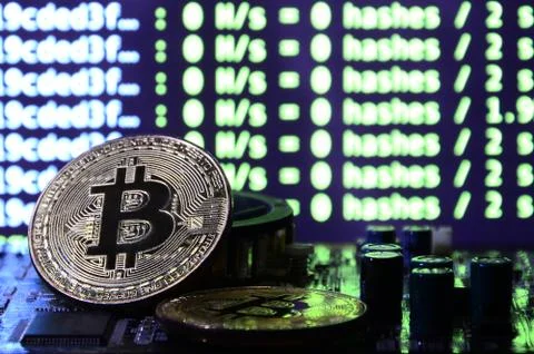 The digital process of cryptocurrency mining by using the GPUs. Bitcoins and  Stockfoto's